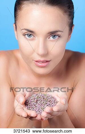 Portrait of a young woman, holding heather in the palm of his hand View Large Photo Image Stock Image - Portrait of a young woman, holding heather in the palm of his hand. Fotosearch