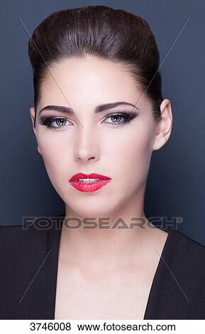 Portrait of a young woman, looking toward the lens View Large Photo Image Stock Photo - Portrait of a young woman, looking toward the lens. Fotosearch