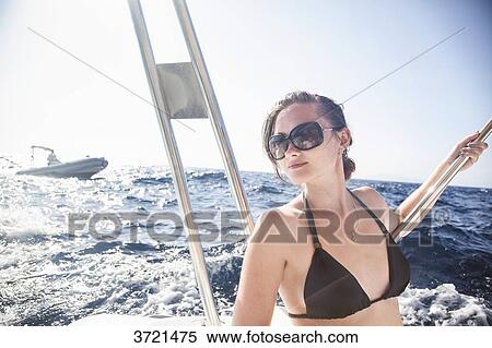Portrait of a young woman on a boat View Large Photo Image Stock Photography - Portrait of a young woman on a boat. Fotosearch