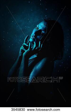 Portrait of a young woman painted in blue sensual look View Large Photo Image Stock Image - Portrait of a young woman painted in blue sensual look. Fotosearch