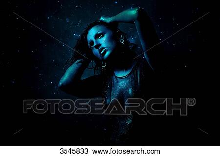 Portrait of a young woman painted in blue holding his head with her hands View Large Photo Image Stock Image - Portrait of a young woman painted in blue holding his head with her hands. Fotosearch