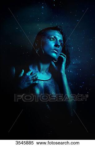 Portrait of a young woman painted in blue View Large Photo Image Stock Photography - Portrait of a young woman painted in blue. Fotosearch