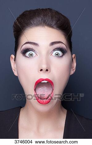 Picture - Portrait of a young woman's attitude surprises. Fotosearch