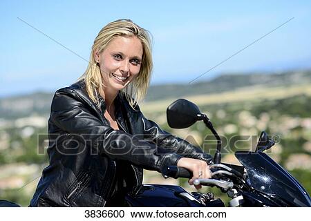 Portrait of attractive young blonde woman riding motorbike in summer. View Large Photo Image Stock Image - Portrait of attractive young blonde woman riding motorbike in summer.. Fotosearch