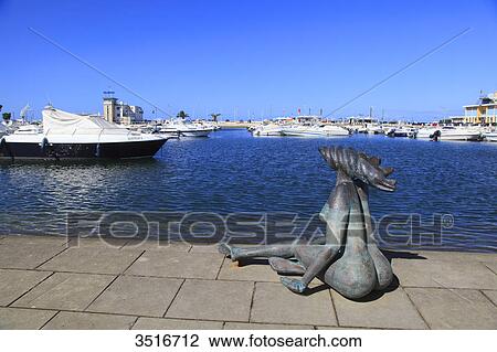 Portugal, Algarve. Faro. Statue in the harbour. View Large Photo Image Stock Image - Portugal, Algarve. Faro. Statue in the harbour.. Fotosearch