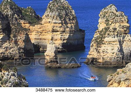 Portugal, Algarve, Lagos. Sculpted cliffs of Ponta da Piedade. View Large Photo Image Stock Photography - Portugal, Algarve, Lagos. Sculpted cliffs of Ponta da Piedade.. Fotosearch