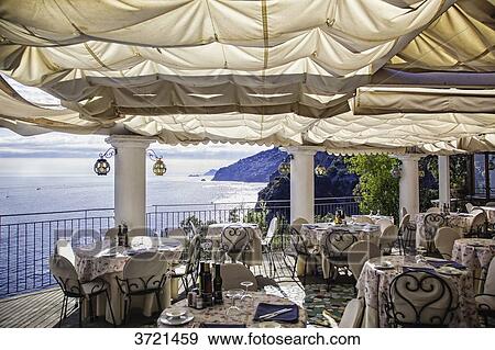 Positano, a terrace restaurant, Amalfi, Provincia Salerno, Italy View Large Photo Image Stock Photo - Positano, a terrace restaurant, Amalfi, Provincia Salerno, Italy. Fotosearch
