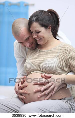 Stock Image - Pregnant woman and her husband. Fotosearch