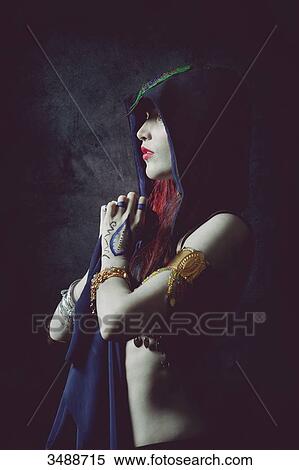 Profile of a mystical woman in ethnic dress View Large Photo Image Stock Photography - Profile of a mystical woman in ethnic dress. Fotosearch