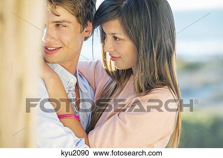 Stock Image - Romantic couple on the beach. Fotosearch