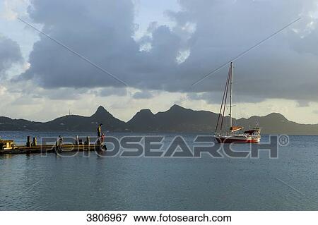 Stock Photo - Sailing boat at the mooring, Saline Bay, Mayreau, Saint-Vincent and the Grenadines, West Indies. Fotosearch
