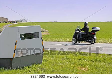 Stock Image - Seine et Marne. New generation radar (mobile radar) on a departmental road. Car. Scooter.. Fotosearch