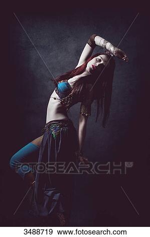 Sensual dance of a woman in ethnic dress View Large Photo Image Stock Photo - Sensual dance of a woman in ethnic dress. Fotosearch