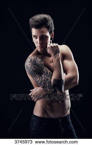 Shirtless young man, hand on cheek, looking to the side View Large Photo Image Stock Image - Shirtless young man, hand on cheek, looking to the side. Fotosearch