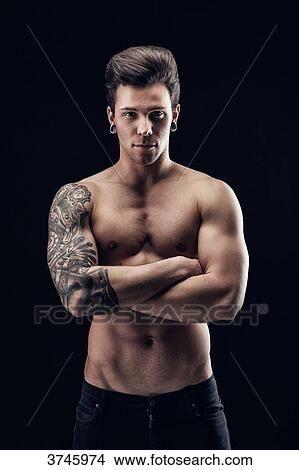 Shirtless young man with crossed arms View Large Photo Image Picture - Shirtless young man with crossed arms. Fotosearch