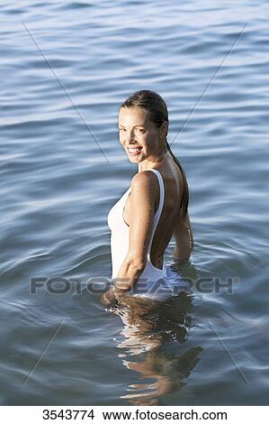 Smilling young woman in the sea View Large Photo Image Picture - Smilling young woman in the sea. Fotosearch
