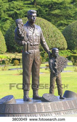Stock Photo - South Korea, Busan. United Nations Memorial Cemetery. Canadian memorial statue. Fotosearch