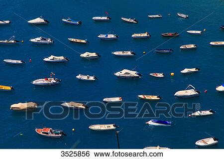 Stock Photograph - Spain, Andalusia, Costa del Sol, lined up boats in Calahonda Bay.. Fotosearch