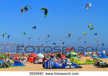 Spain, Andalusia, Tarifa, crowded beach, sky full of kites, Africa in background View Large Photo Image Stock Image - Spain, Andalusia, Tarifa, crowded beach, sky full of kites, Africa in background. Fotosearch