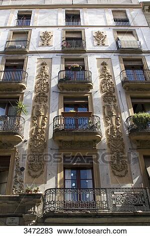 Spain, Catalonia, Barcelona, El Raval area, Carrer de l'Hospital, facade of a housing building View Large Photo Image Stock Image - Spain, Catalonia, Barcelona, El Raval area, Carrer de l'Hospital, facade of a housing building. Fotosearch