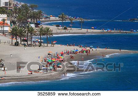 Spain, Province of Granada. Castell de Ferro. People on the beach seen from above. View Large Photo Image Stock Photo - Spain, Province of Granada. Castell de Ferro. People on the beach seen from above.. Fotosearch