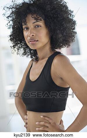 Sportswoman standing with hands on hips View Large Photo Image Stock Photo - Sportswoman standing with hands on hips. Fotosearch