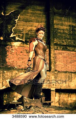 Stock Image - Steampunk woman in action. Fotosearch