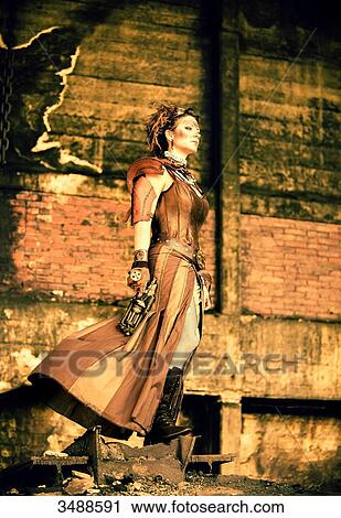 Steampunk woman watching the horizon View Large Photo Image Stock Image - Steampunk woman watching the horizon. Fotosearch