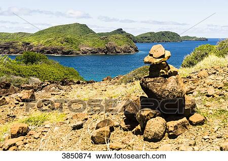 Stone cairn and view on sea, Petit Nevis, Saint-Vincent and the Grenadines, West Indies View Large Photo Image Picture - Stone cairn and view on sea, Petit Nevis, Saint-Vincent and the Grenadines, West Indies. Fotosearch