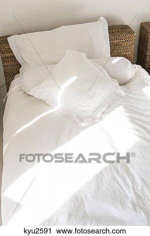 Sunlight falling on a bed View Large Photo Image Stock Image - Sunlight falling on a bed. Fotosearch