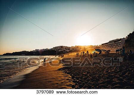 Sunset on the beach in Albufeira, Algarve district, Portugal View Large Photo Image Stock Photo - Sunset on the beach in Albufeira, Algarve district, Portugal. Fotosearch
