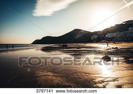 Sunset on the beach of Burgau, Algarve region, Portugal View Large Photo Image Stock Image - Sunset on the beach of Burgau, Algarve region, Portugal. Fotosearch