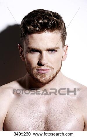 Topless man, serious, against a white wall, hard shadow on the wall, looking at camera View Large Photo Image Stock Image - Topless man, serious, against a white wall, hard shadow on the wall, looking at camera. Fotosearch