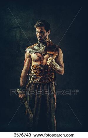 Tribal warrior standing clenched fist View Large Photo Image Stock Image - Tribal warrior standing clenched fist. Fotosearch