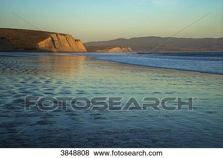 Stock Photo - USA, California, Marin County, Point Reyes, Point Reyes National Seashore, Drakes Beach, sunset on the beach. Fotosearch