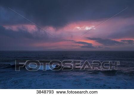 Stock Image - USA, California, Sonoma County, Bodega Bay, twilight on the ocean. Fotosearch