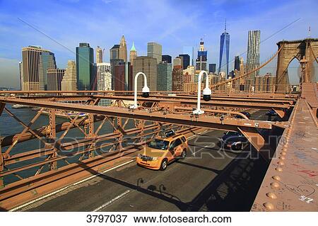 Stock Photo - Usa, New-York City. Taxi. Brooklyn Bridge.. Fotosearch