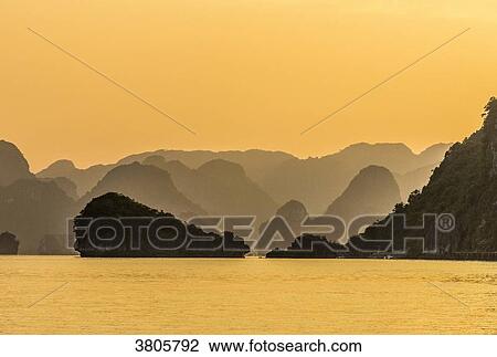 Vietnam, Ha Long Bay at sunset, (UNESCO World Heritage) View Large Photo Image Stock Image - Vietnam, Ha Long Bay at sunset, (UNESCO World Heritage). Fotosearch