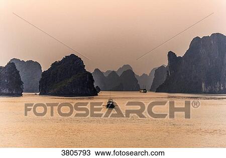 Vietnam, Ha Long Bay at sunset, (UNESCO World Heritage) View Large Photo Image Stock Image - Vietnam, Ha Long Bay at sunset, (UNESCO World Heritage). Fotosearch