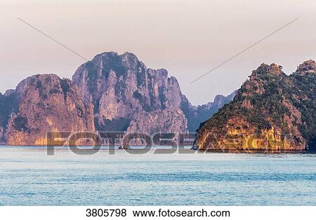 Vietnam, Ha Long Bay at sunset, (UNESCO World Heritage) View Large Photo Image Stock Photo - Vietnam, Ha Long Bay at sunset, (UNESCO World Heritage). Fotosearch