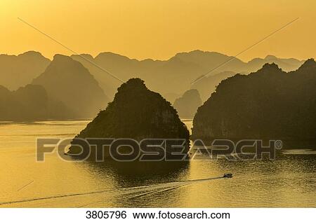 Vietnam, Ha Long Bay at sunset, (UNESCO World Heritage) View Large Photo Image Stock Photograph - Vietnam, Ha Long Bay at sunset, (UNESCO World Heritage). Fotosearch