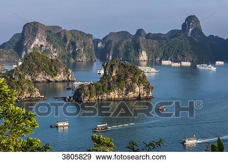 Stock Photo - Vietnam, Ha Long Bay, cruise boat in the middle of islets (UNESCO World Heritage). Fotosearch