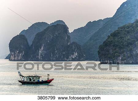 Stock Photo - Vietnam, Ha Long Bay, fisher's small boat (UNESCO World Heritage). Fotosearch