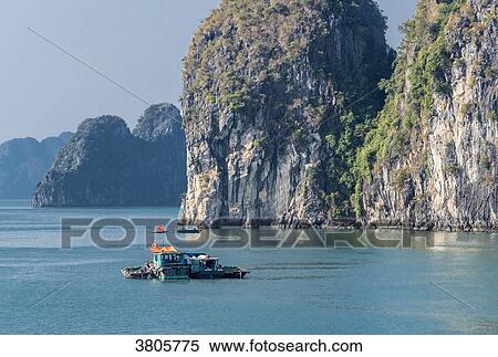 Vietnam, Ha Long Bay, fisher's small boat (UNESCO World Heritage) View Large Photo Image Stock Photography - Vietnam, Ha Long Bay, fisher's small boat (UNESCO World Heritage). Fotosearch