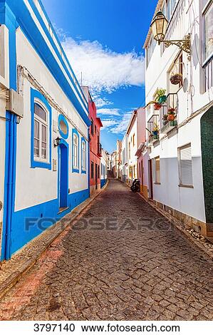 View of a cobblestone street, town of Burgau, Algarve region, Portugal View Large Photo Image Stock Image - View of a cobblestone street, town of Burgau, Algarve region, Portugal. Fotosearch