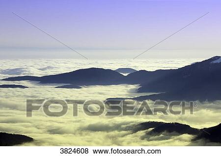Vosges. The mountains seen from the Grand Ballon d'Alsace in winter. Sea of clouds. View Large Photo Image Stock Photo - Vosges. The mountains seen from the Grand Ballon d'Alsace in winter. Sea of clouds.. Fotosearch