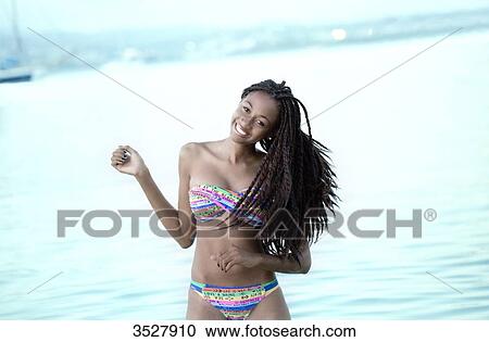West indian smiling young girl dancing View Large Photo Image Stock Image - West indian smiling young girl dancing. Fotosearch