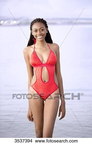 West indian smiling young girl in swimsuit View Large Photo Image Picture - West indian smiling young girl in swimsuit. Fotosearch