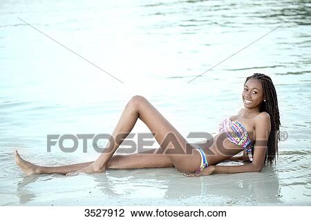 West indian smiling young girl in swimsuit View Large Photo Image Stock Image - West indian smiling young girl in swimsuit. Fotosearch