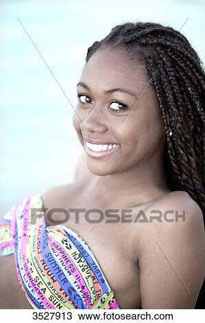 Stock Image - West indian smiling young girl. Fotosearch